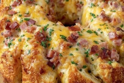 Thumbnail for Cheesy meat and Bread Wreath A Beautiful, Golden, and Flaky Centerpiece Stuffed with Savory Deli Ham and Melted Cheese
