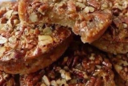 Thumbnail for Pecan Pie Cookies A Buttery, Brown Sugar Cookie Topped with a Gooey, Caramelized Pecan Filling