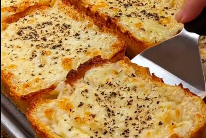 Thumbnail for Texas Toast with Cheese: Thick, Buttery Garlic Toast with a Three-Cheese Topping